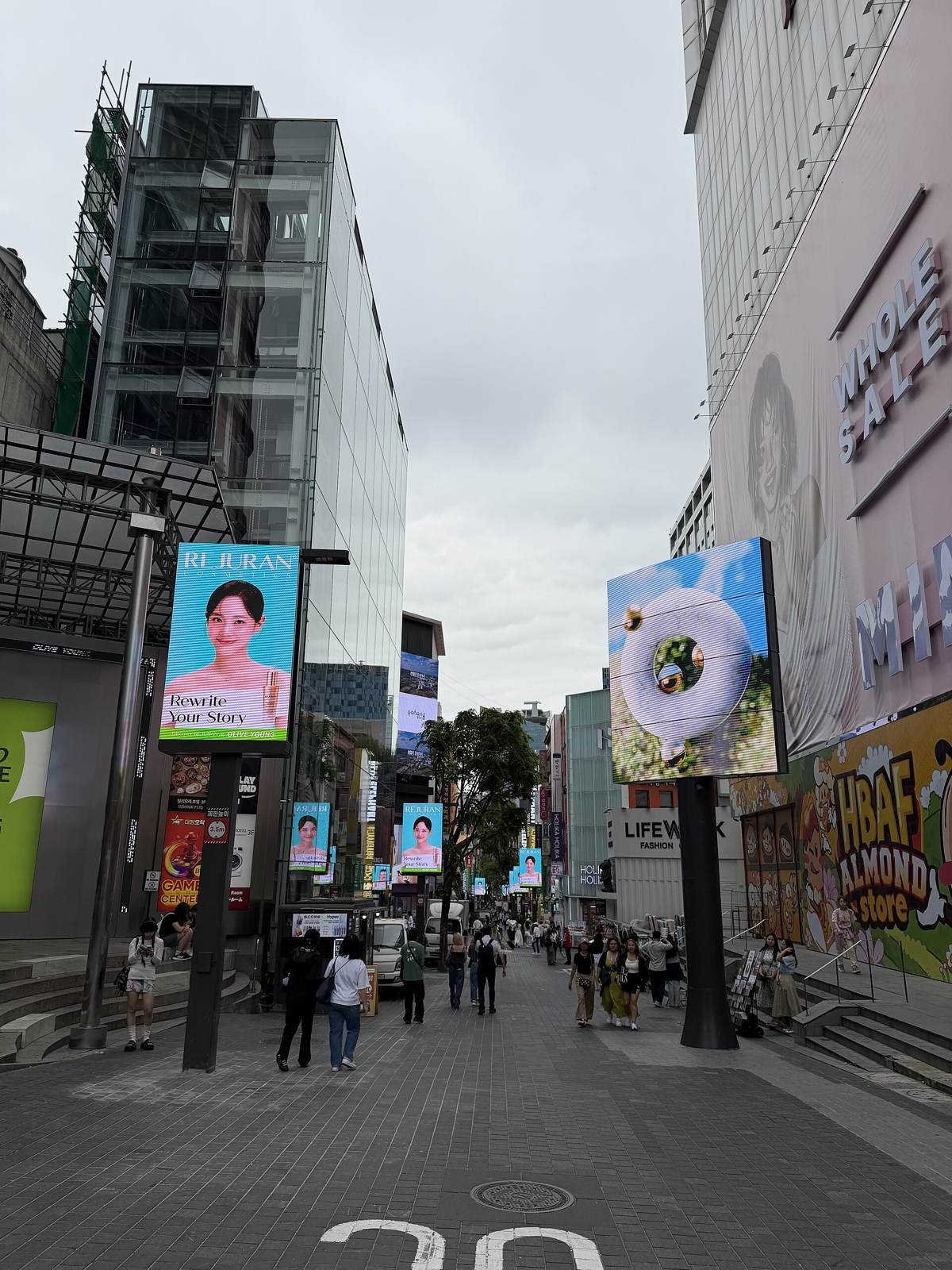 Shopping street in Myeongdong, Seoul, lined with Korean-language signs